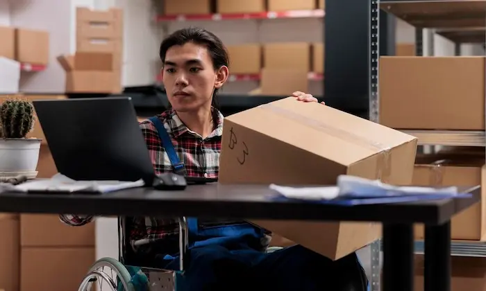 Logistics professional processing an e-commerce order for dispatch at a Dubai fulfillment center.