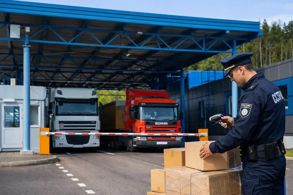 Customs official inspecting cargo shipments, illustrating the rigorous compliance and documentation process managed by FastShip as your clearing agent.