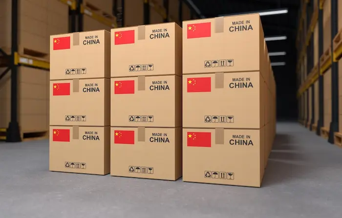 Close-up of brown shipping boxes labeled Dubai and Saudi Arabia, representing FastShip’s hassle-free door-to-door DDP cargo and cross-border fulfillment services.